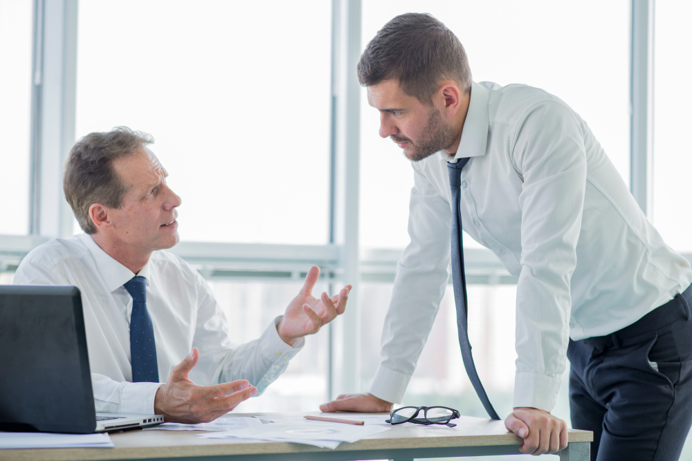 A Personal Injury Attorney in Normal IL talking with her clients