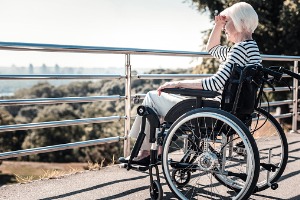 An elderly woman in a wheelchair needing a Social Security Attorney in Pekin IL