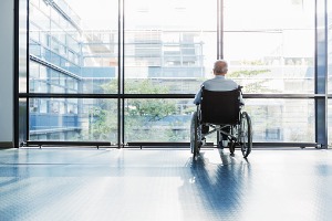 Older gentleman sitting in wheelchair, Nursing Home Abuse Lawyer Peoria IL